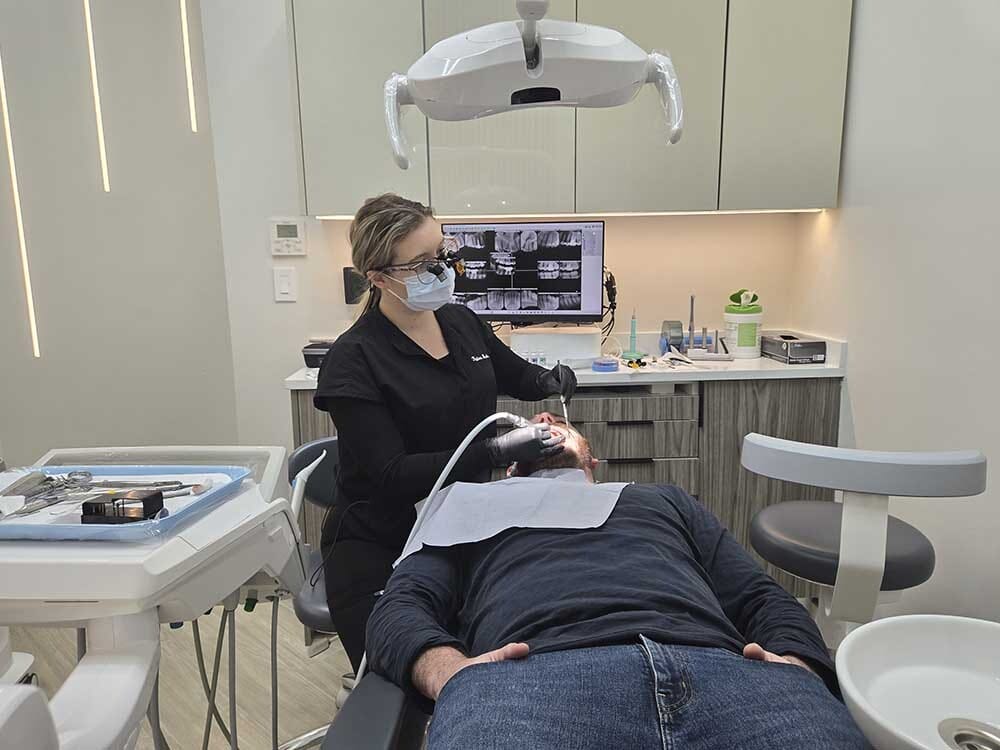 Dental hygienist providing care at VITAdent Brooklyn