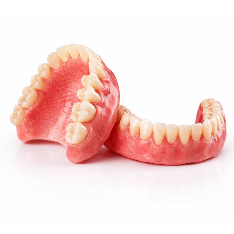 High-resolution image of upper and lower full dentures showing natural-looking teeth, realistic pink acrylic gums, and precise occlusal anatomy for complete denture tooth replacement in Brooklyn, NY.